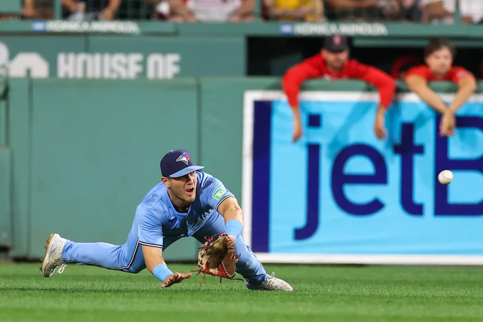 Blue Jays center fielder Daulton Varsho attempts to make a diving catch in an Aug. 28, 2024, game against the Red Sox in Boston.