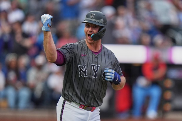 New York Mets' Pete Alonso gestures to teammates as he runs the bases after hitting a home run during the eighth inning of a baseball game against the St. Louis Cardinals Saturday, April 19, 2025, in New York. (AP Photo/Frank Franklin II)