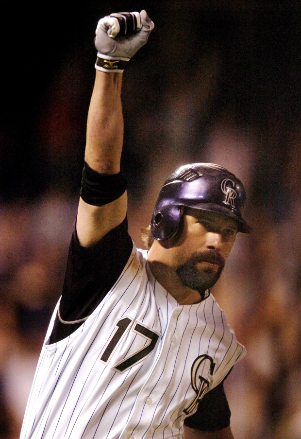 Todd Helton pumped his fist after watching his ninth-inning home run clear the fence to beat the Los Angeles Dodgers 9-8 on Sept. 18, 2007, at Coors Field in Denver. (Photo by Karl Gehring/The Denver Post)
