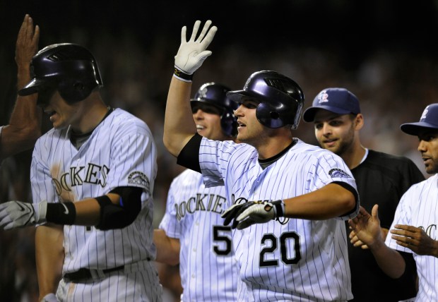 Chris Ianetta (20) celebrated with teammates after he singled in Matt Holliday from third in the bottom of the ninth inning to beat the Florida Marlins 18-17 in the biggest come-back victory in team history on July 4, 2008, at Coors Field in Denver. (Photo by Karl Gehring/The Denver Post)