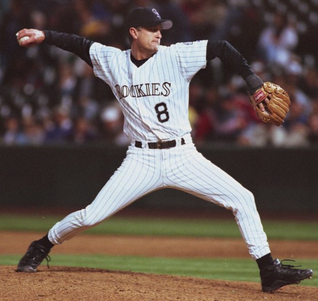 Colorado Rockies Brent Mayne throws to the plate during the 12th inning against the Atlanta Braves at Coors Field in Denver, Tuesday, Aug. 22, 2000. Mayne, a catcher, was called on for his first major league pitching appearance after the Rockies ran out of relievers. (AP Photo/Jack Dempsey)
