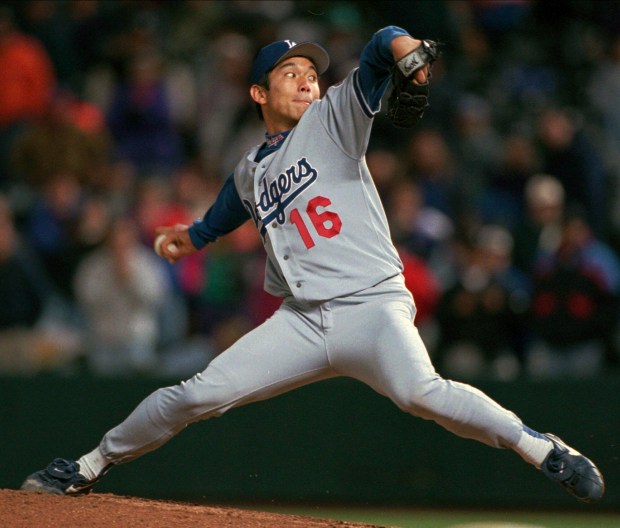 Los Angeles Dodgers starting pitcher Hideo Nomo delivers a pitch to Colorado Rockies batter Ellis Burks on the way to striking him out and notching a no-hit performance in the Dodgers' 9-0 victory in Denver's Coors Field on Sept. 17, 1996. (AP Photo/David Zalubowski)