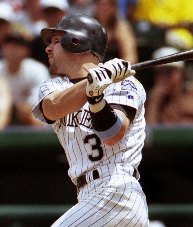 Colorado Rockies' Mike Lansing watches his two-run home run off Arizona Diamondbacks starting pitcher Armando Reynoso during the second inning at Coors Field in Denver, on June 18, 2000. (AP Photo/Jack Dempsey)