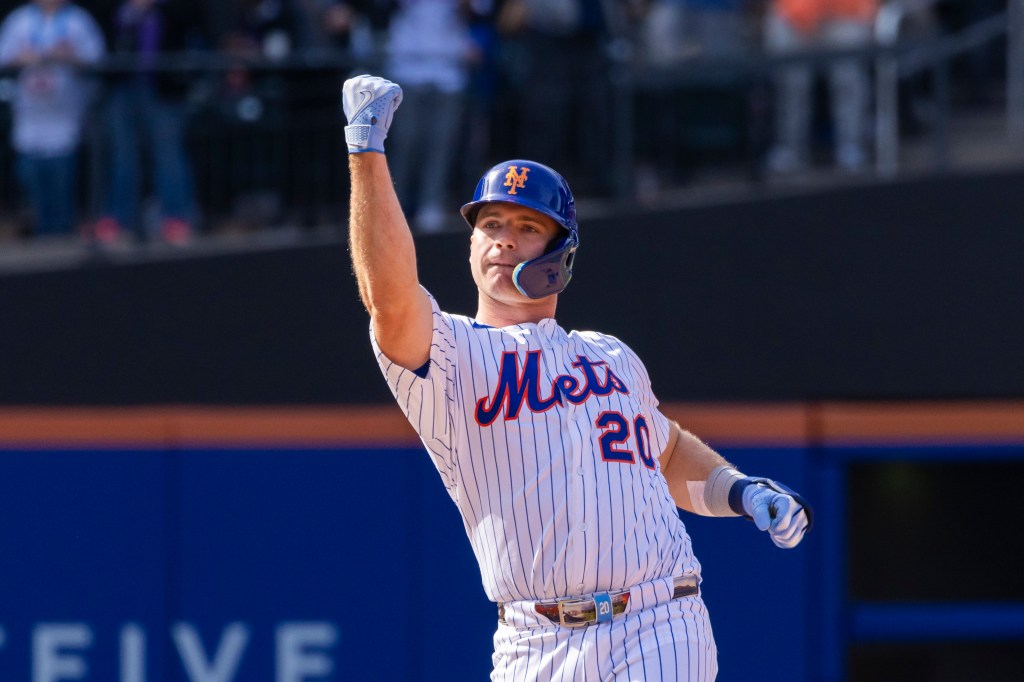 Mets first base Pete Alonso (20) reacts after he hits an RBI double driving home New York Mets shortstop Francisco Lindor (12) to tie the game in the 10th inning against the Philadelphia Phillies. 