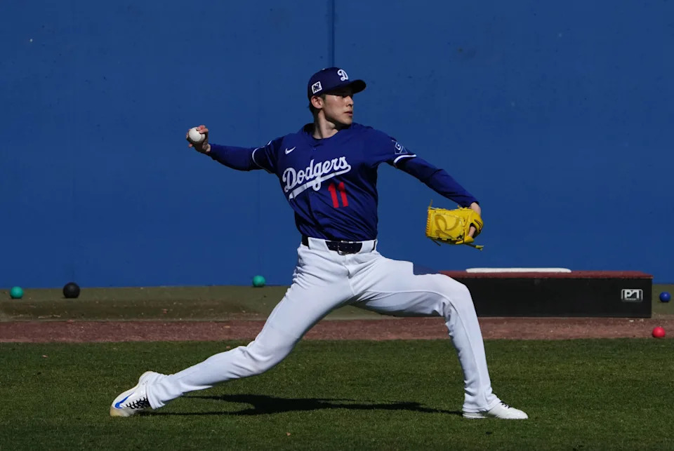 Los Angeles Dodgers pitcher Roki Sasaki throws during a Spring Training workout at Camelback Ranch.Joe Camporeale-Imagn Images