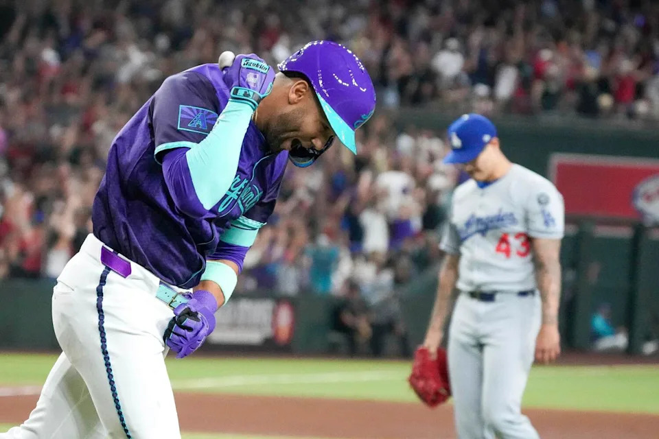 Arizona Diamondbacks outfielder Lourdes Gurriel Jr. pumps his fist after hitting a grand slam.