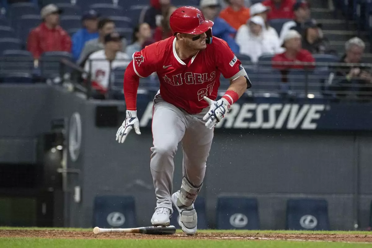 Los Angeles Angels' Mike Trout watches his single off Cleveland Guardians starting pitcher Luis Ortiz during the fourth inning of a baseball game, Friday, May 30, 2025, in Cleveland. (AP Photo/Phil Long)