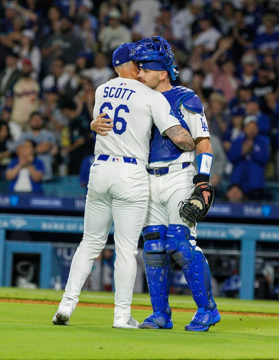 Dodgers pitcher Tanner Scott embraces catcher Dalton Rushing after a 3-1 win over the Arizona Diamondbacks