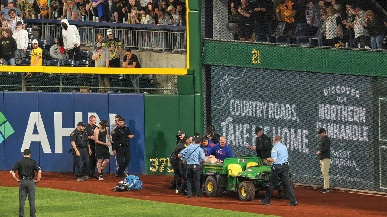 A fan is carted off the field at PNC Park after falling out of the stands during the 7th inning of a baseball game between the Pirates and the Cubs in Pittsburgh, April 30, 2025.