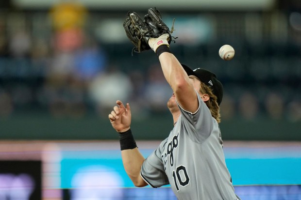 White Sox shortstop Chase Meidroth can't catch a ball hit by the Royals' Drew Waters for a fielding error during the ninth inning Tuesday, May 6, 2025, in Kansas City, Mo. (AP Photo/Charlie Riedel)