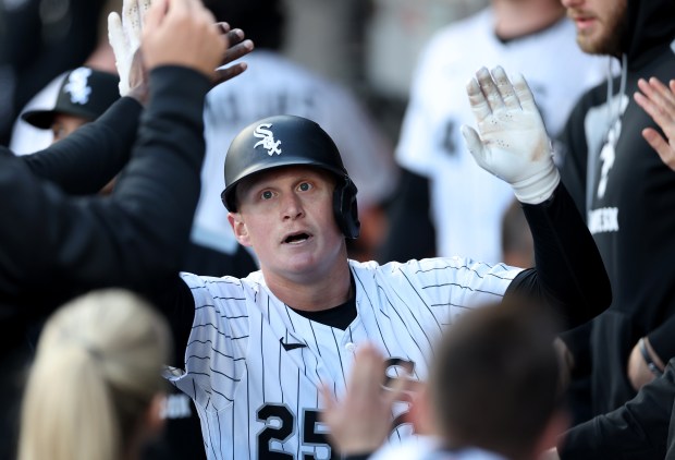 Chicago White Sox designated hitter Andrew Vaughn is congratulated by his teammates in the dugout after hitting a solo home run in the first inning of a game against the Miami Marlins at Rate Field in Chicago on May 10, 2025. (Chris Sweda/Chicago Tribune)