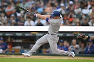 Texas Rangers' Corey Seager hits an RBI double against the Detroit Tigers during the fifth...