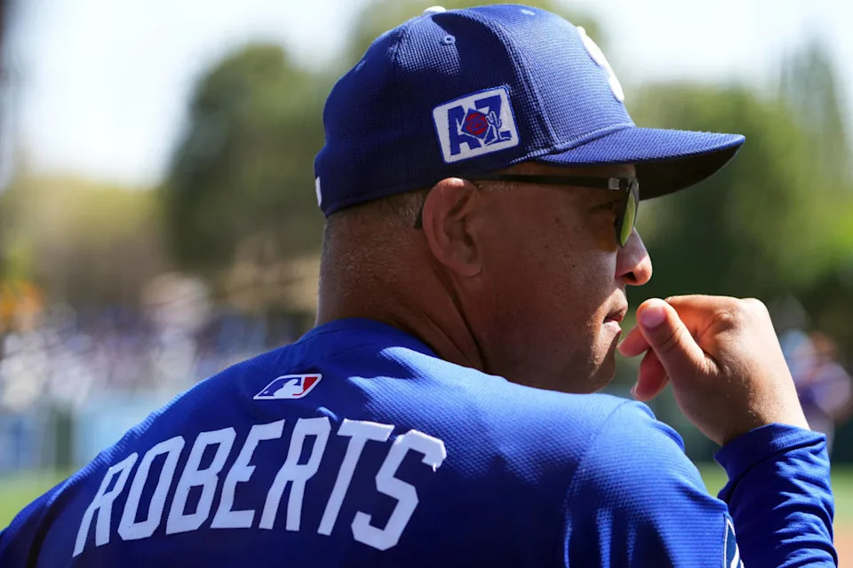 Los Angeles Dodgers manager Dave Roberts (30) looks on against the Texas Rangers during the third inning at Camelback Ranch-Glendale.Joe Camporeale-Imagn Images