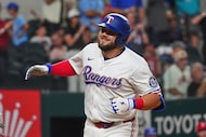 Texas Rangers Jake Burger smiles after hitting a home run during the sixth inning of a...