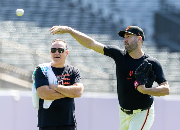 San Francisco Giants trainer Dave Groeschner watches Justin Verlander throws in the outfield, Wednesday morning, May 21, 2025, at Oracle Park in San Francisco, Calif. (Karl Mondon/Bay Area News Group)