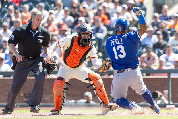 San Francisco Giants catcher Patrick Bailey tags out Kansas City...