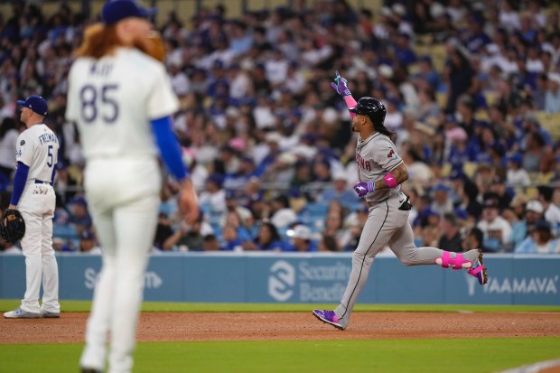 The Arizona Diamondbacks’ Ketel Marte, right, gestures as he runs...