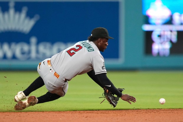 Arizona Diamondbacks shortstop Geraldo Perdomo fields a ball hit for...