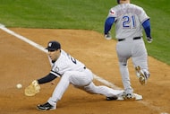 Texas Rangers Jeff Francoeur reaches first base on an infield single in the top of the 7th...