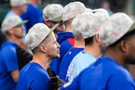 Texas Rangers shortstop Corey Seager watches from the dugout during the eighth inning of a...