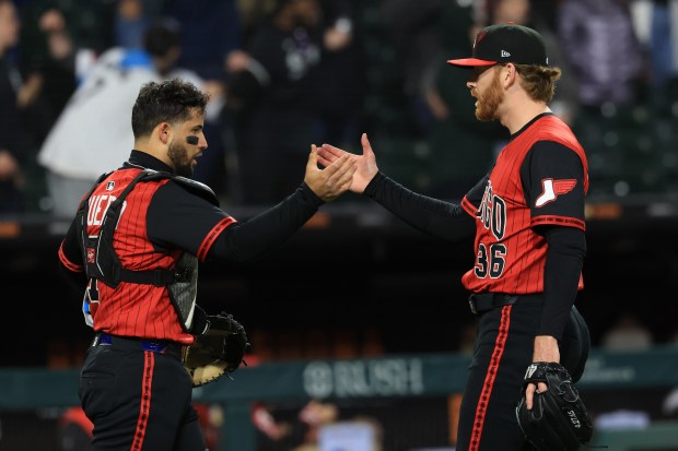 White Sox catcher Edgar Quero, left, and reliever Steven Wilson celebrate a 4-1 win over the Rangers on May 23, 2025, at Rate Field. (John J. Kim/Chicago Tribune)