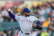 Texas Rangers pitcher Kumar Rocker (80) throws a pitch to an Athletics batter during the...
