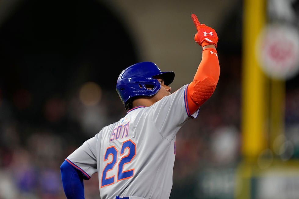 New York Mets' Juan Soto celebrates after hitting a home run against the Houston Astros during...