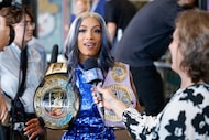 AEW star Mercedes Moné speaks with reporters after a news conference announcing a new...