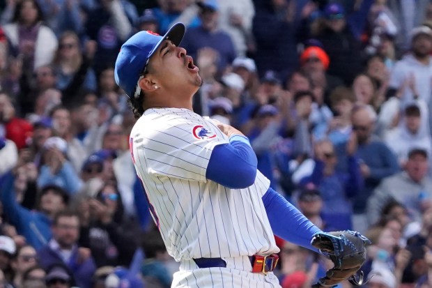 Chicago Cubs pitcher Daniel Palencia reacts after getting the final out against the Colorado Rockies during the ninth inning of a baseball game Monday, May 26, 2025, in Chicago. (AP Photo/David Banks)