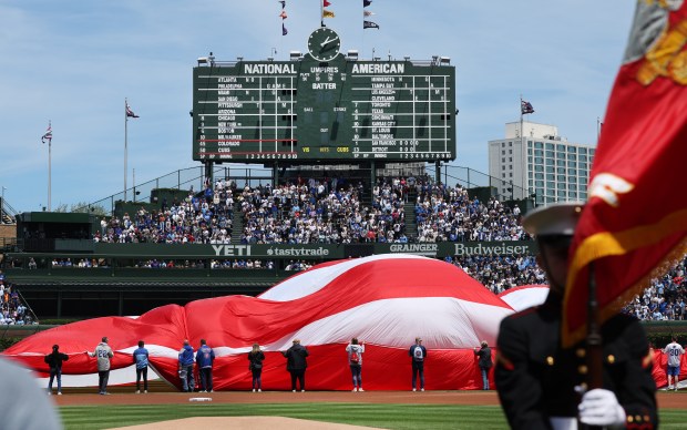 A U.S. flag is displayed on the field to commemorate Memorial Day prior to a game between the Chicago Cubs and the Colorado Rockies at Wrigley Field in Chicago on May 26, 2025. (Chris Sweda/Chicago Tribune)