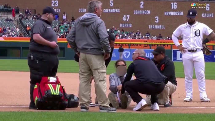 Injured Detroit Tigers groundskeeper flips off camera while being attended to by medical staff