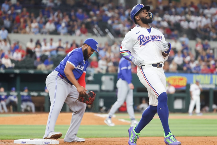 Texas Rangers outfielder Adolis García grounds out during the second inning of a baseball...