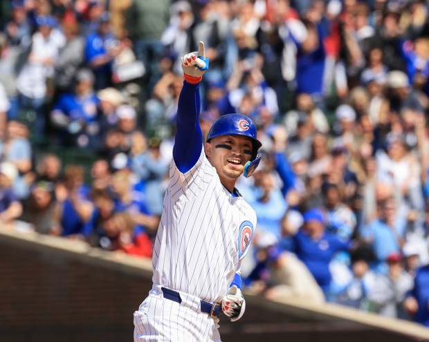 Cubs designated hitter Seiya Suzuki gestures to teammates after hitting an RBI double against the Reds in the eighth inning May 31, 2025, at Wrigley Field. (John J. Kim/Chicago Tribune)