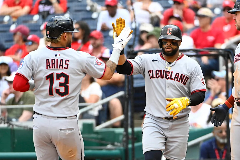 May 7, 2025; Washington, District of Columbia, USA; Cleveland Guardians second baseman Gabriel Arias (13) and first baseman Carlos Santana (41) celebrate after both scored during the sixth inning against the Washington Nationals at Nationals Park. Mandatory Credit: Brad Mills-Imagn Images