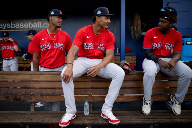 PORT CHARLOTTE, FLORIDA - MARCH 13:Boston Red Sox prospects Yordanny Monegro, Brandon Clarke, and Juan Valera react in the dugout before a 2025 MLB Spring Breakout game against the Tampa Bay Rays at Charlotte Sports Park in Port Charlotte, Florida on March 13, 2025. (Photo by Maddie Malhotra/Boston Red Sox/Getty Images) *** Local Caption *** Yordanny Monegro; Brandon Clarke; Juan Valera