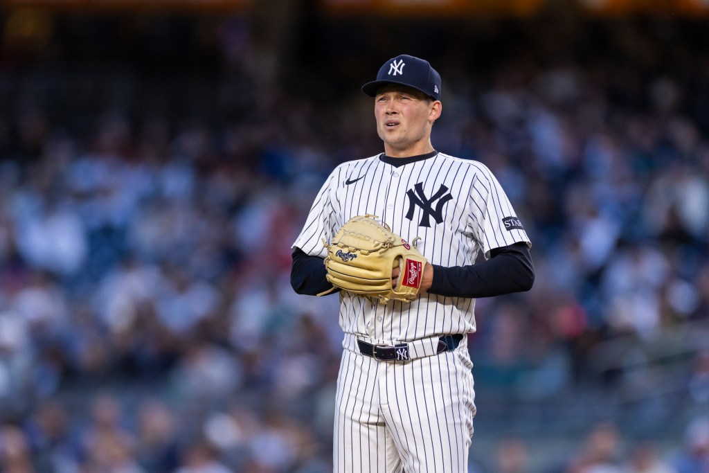 New York Yankees pitcher Will Warren (98) prepares to throw in the third inning against the Texas Rangers at Yankee Stadium, Tuesday, May 20, 2025, in Bronx, NY. 