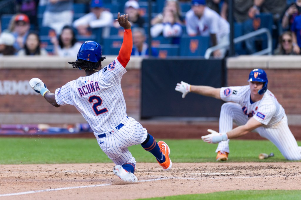 Luisangel Acuña slides to score during the Mets' win against the White Sox on May 26.