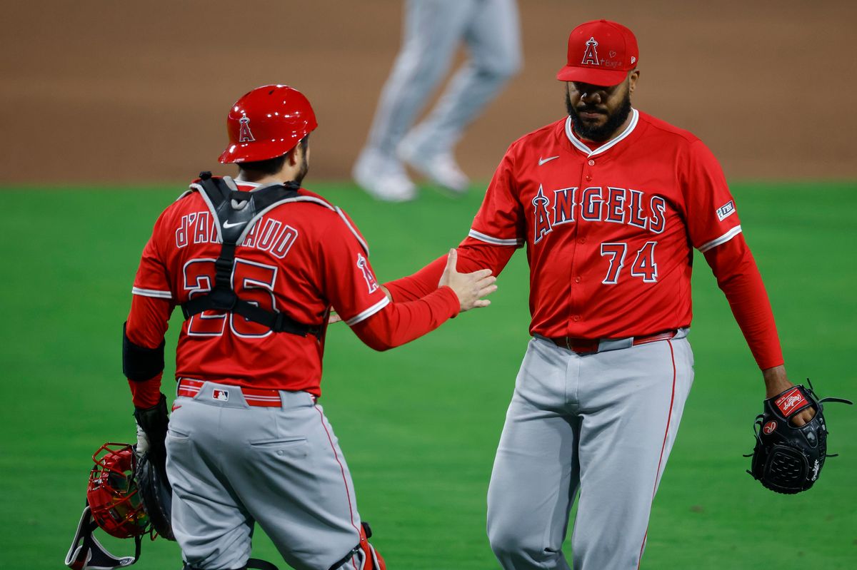 Kenley Jansen #74 of the Los Angeles Angels celebrates with Travis d'Arnaud #25 after the final out in a team victory against the San Diego Padres at Petco Park on May 12, 2025 in San Diego, California.