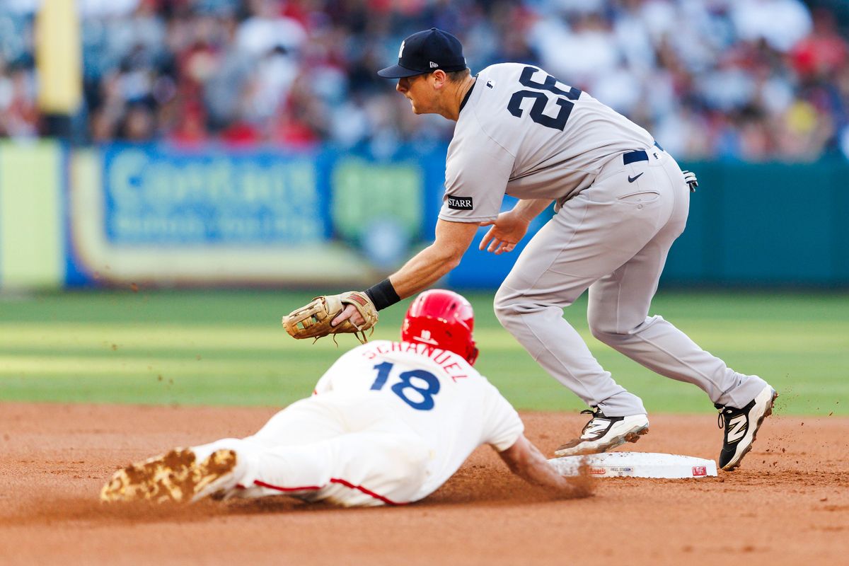 Nolan Schanuel #18 of the Los Angeles Angels slides into second base against  Ben Rice #22 of the New York Yankees during the game at Angel Stadium of Anaheim on May 27, 2025 in Anaheim, California.