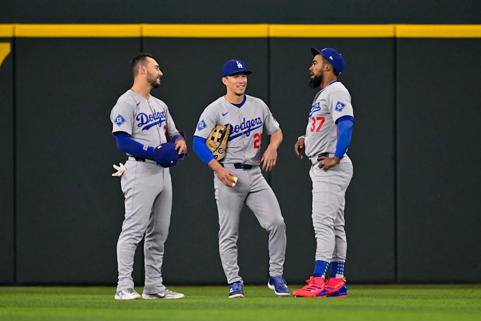 Los Angeles Dodgers outfielders Michael Conforto (23), Tommy Edman (25) and Teoscar Hernandez (37) at Globe Life Field.Jerome Miron-Imagn Images