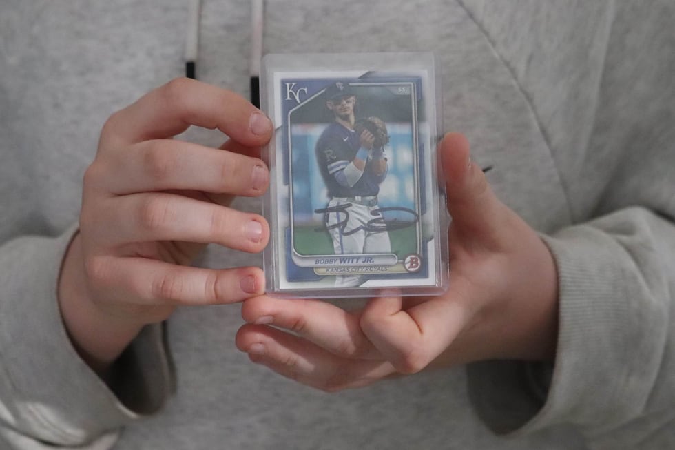 Fifth grader Alden Truesdell-Kinkeade bought a Bobby Witt Jr. baseball card from an antique...