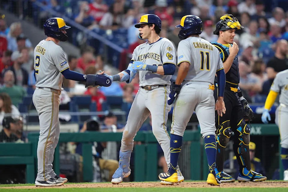 May 30, 2025; Philadelphia, Pennsylvania, USA; Milwaukee Brewers outfielder Christian Yelich (22) reacts with teammates after hitting a three-run home run against the Philadelphia Phillies in the fifth inning at Citizens Bank Park. Mandatory Credit: Kyle Ross-Imagn Images