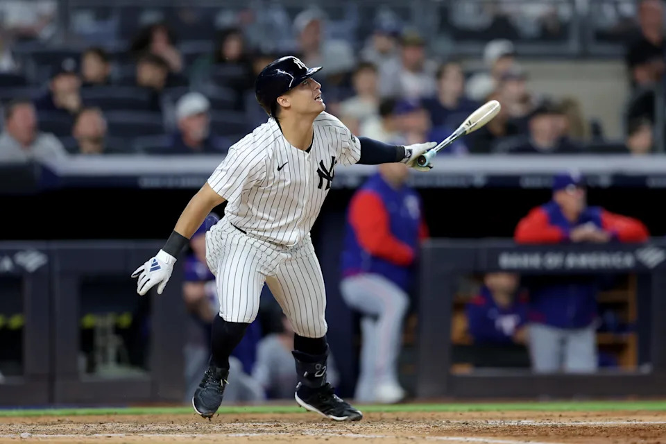 May 20, 2025; Bronx, New York, USA; New York Yankees shortstop Anthony Volpe (11) follows through on an RBI doubt against the Texas Rangers during the sixth inning at Yankee Stadium.