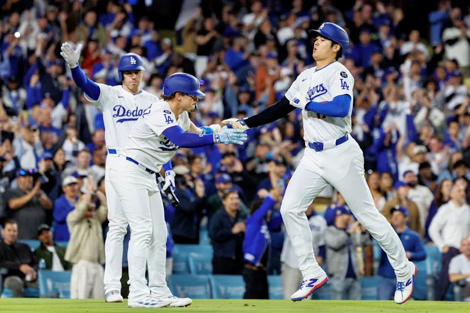 Shohei Ohtani, right, celebrates with Kiké Hernández after scoring on Mookie Betts' two-run double.