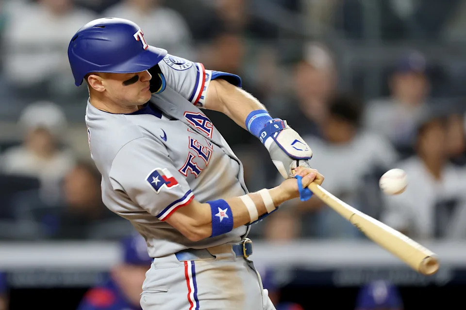 NEW YORK, NEW YORK - MAY 20: Josh Jung #6 of the Texas Rangers hits a single against the New York Yankees during the sixth inning at Yankee Stadium on May 20, 2025 in New York City.