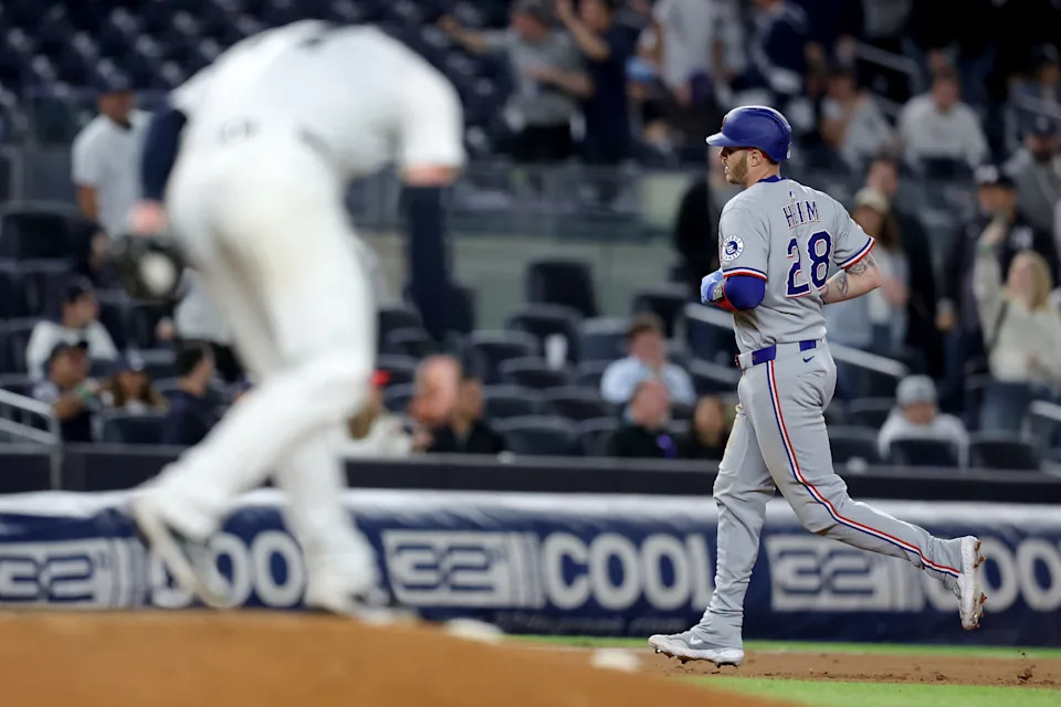 May 20, 2025; Bronx, New York, USA; Texas Rangers catcher Jonah Heim (28) rounds the bases after hitting a two run home run against New York Yankees relief pitcher Ian Hamilton (71) during the ninth inning at Yankee Stadium.