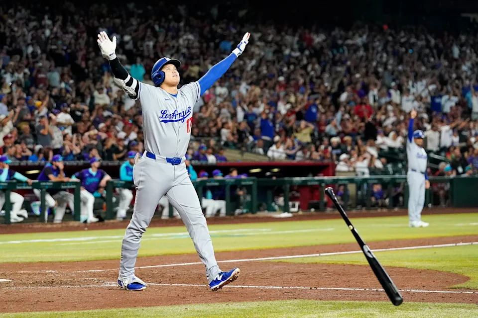 Los Angeles Dodgers' Shohei Ohtani celebrates a three run home run against for the Arizona Diamondbacks during the ninth inning of a baseball game Friday, May 9, 2025, in Phoenix. (AP Photo/Darryl Webb)
