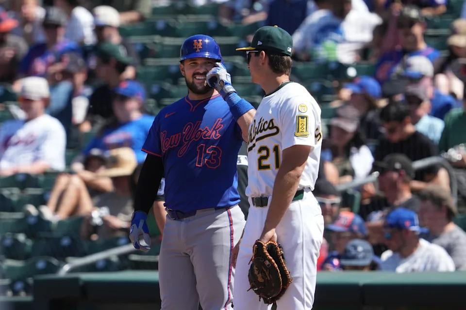 New York Mets catcher Luis Torrens (13) talks with Athletics first baseman Tyler Soderstrom (21) after hitting an RBI-single during the sixth inning on April 13, 2025, at Sutter Health Park.