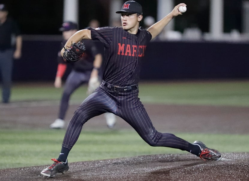 Flower Mound Marcus High School pitcher Emerson McKnight (17) delivers a pitch in the first...