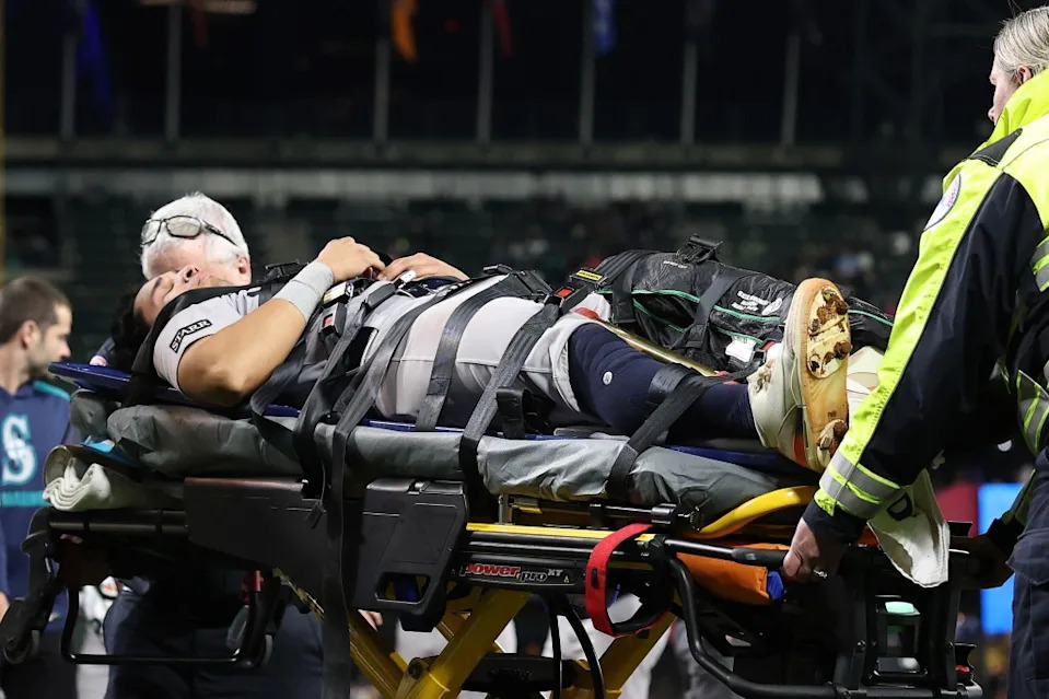 Oswaldo Cabrera is loaded into an ambulance after suffering a leg injury on May 12, 2025. Getty Images